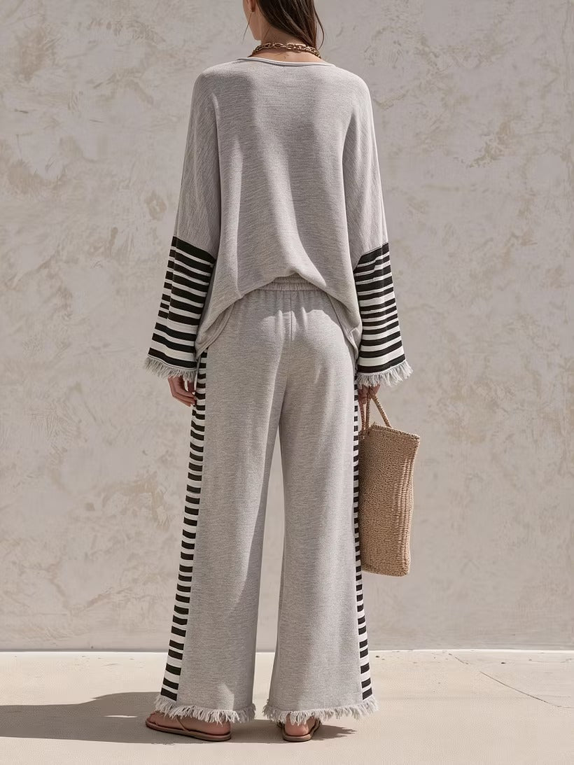 Casual grey two-piece set with striped paneling and a loose fit