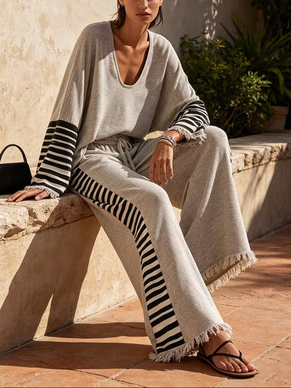 Casual grey two-piece set with striped paneling and a loose fit