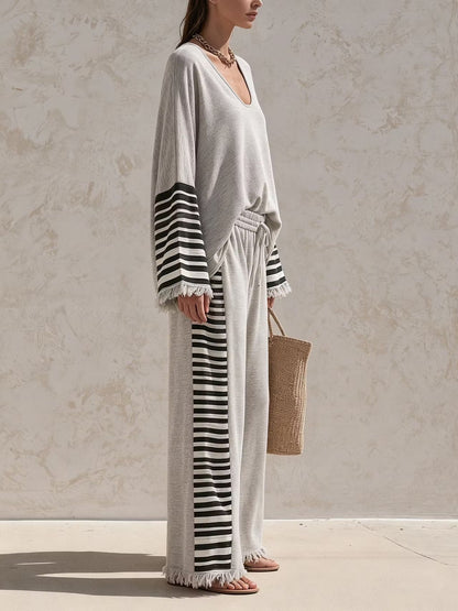 Casual grey two-piece set with striped paneling and a loose fit