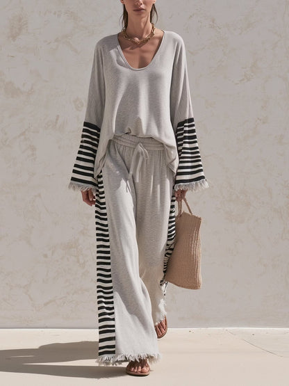 Casual grey two-piece set with striped paneling and a loose fit